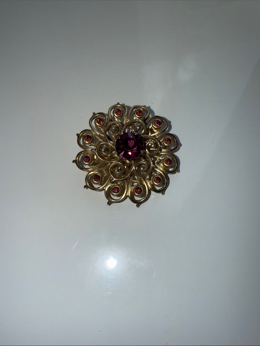 Gold-Tone Floral Brooch with Deep Pink Center Stone